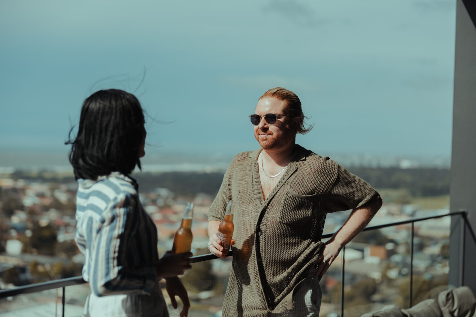 Friends on a Wollongong apartment balcony